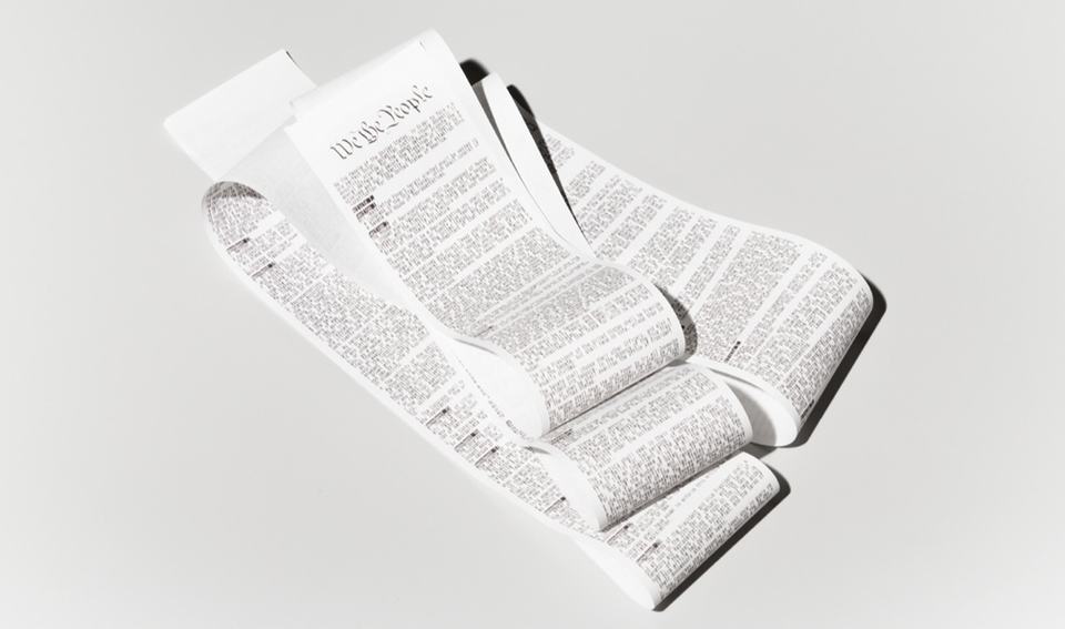 A hacktivist artist printing the US Constitution on a sales receipt